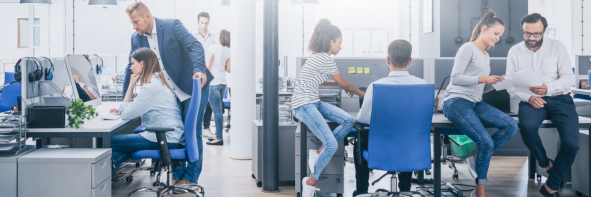 Collaborative office environment with teams working together, illustrating custom PEO solutions for industry-specific HR challenges.