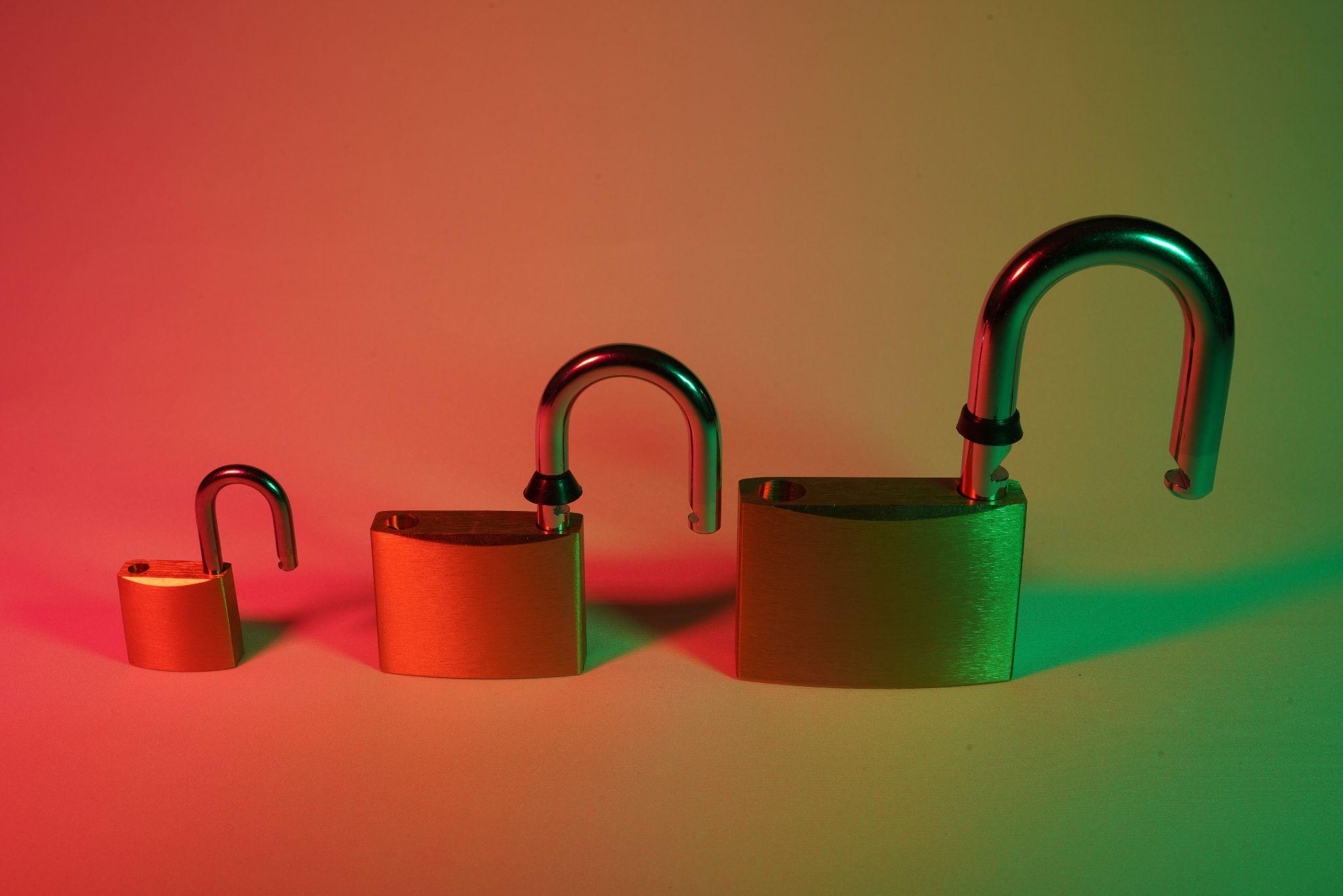 Series of unlocked padlocks symbolizing security vulnerabilities and risks of phishing scams
