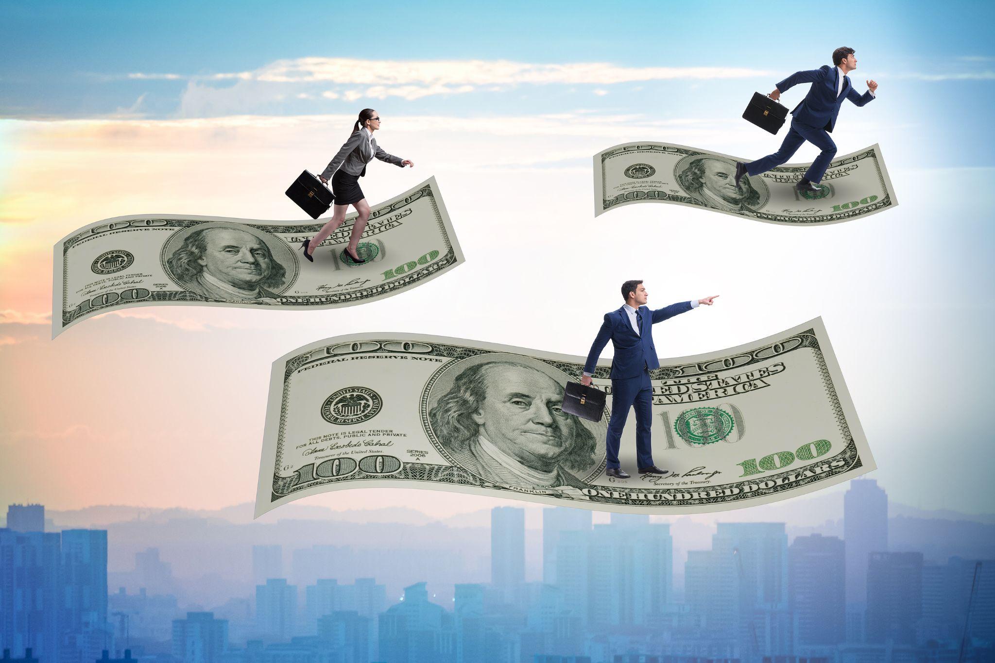 Business professionals soaring on hundred-dollar bills, symbolizing payroll compliance success in California