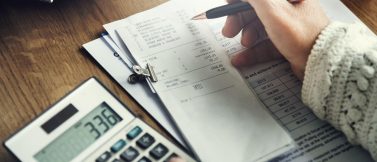 Calculating payroll to ensure California wage statement compliance with receipts and calculator