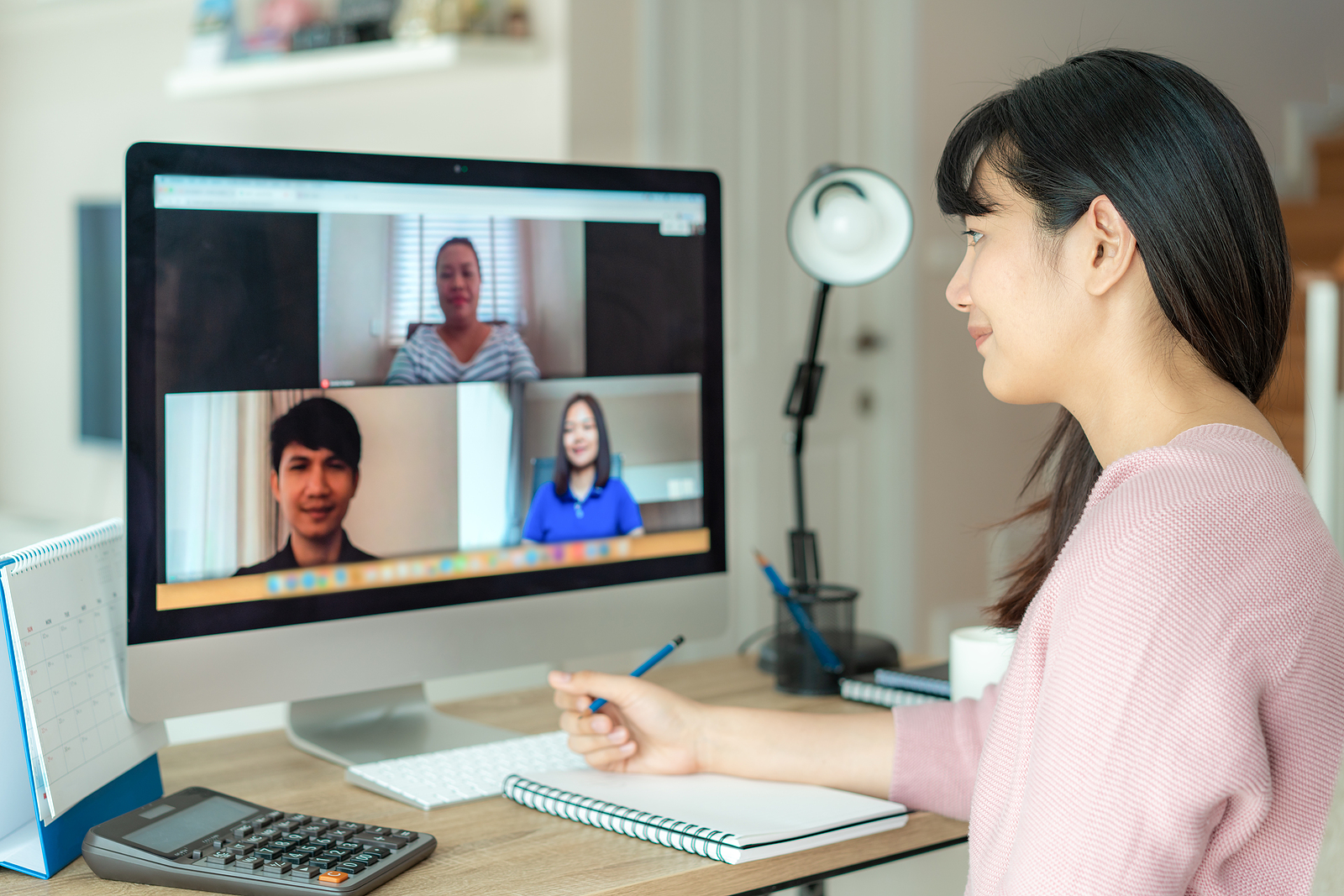 Remote team participating in online training via learning management system, showing modern training solutions and flexible employee training methods.